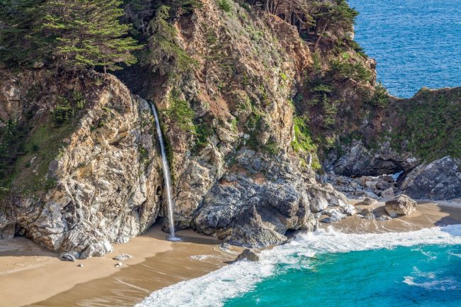at the scenic landscape of McWay Falls near Big Sur California