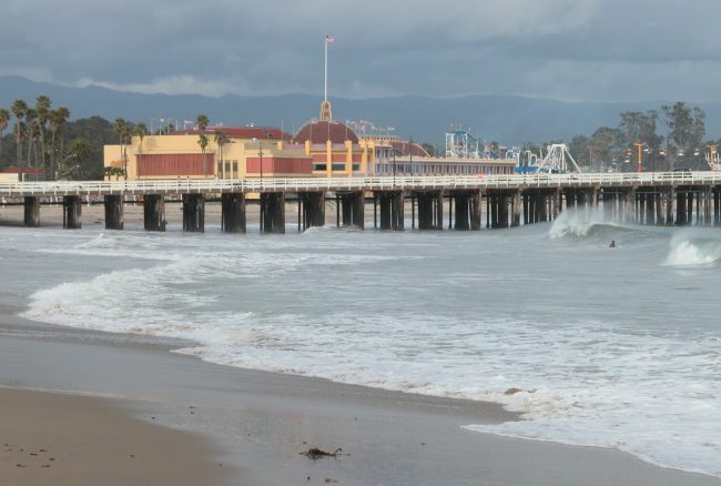 Waves slap the sandy shore of the California coast at Santa Cruz.