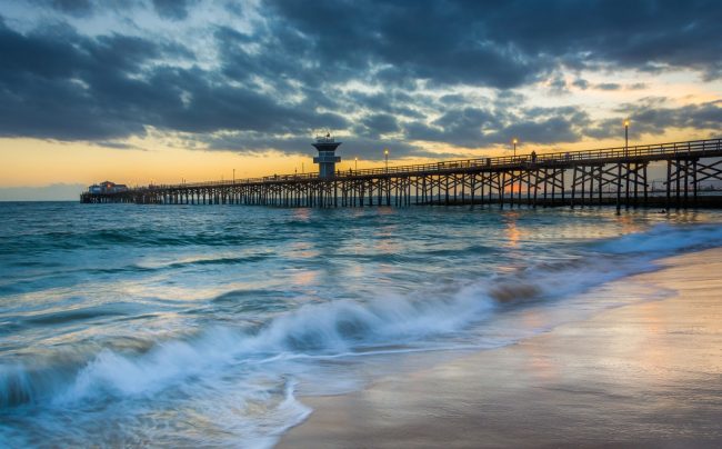 Waves In The Pacific Ocean And The Pier At Sunset, In Seal Beach